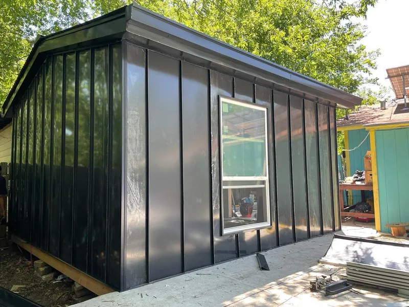 Black standing seam metal wall panels for Roof Inspection in Gulfport