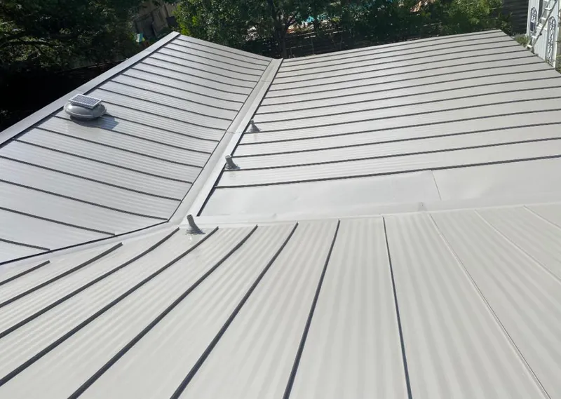 Solar attic fan installed on a metal roof for Roof Ventilation in Gulfport